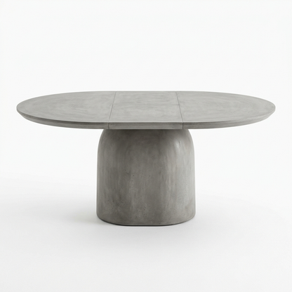 Concrete grey extendable pedestal dining table on a white background