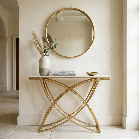 White console table with gold frame in an elegant hallway